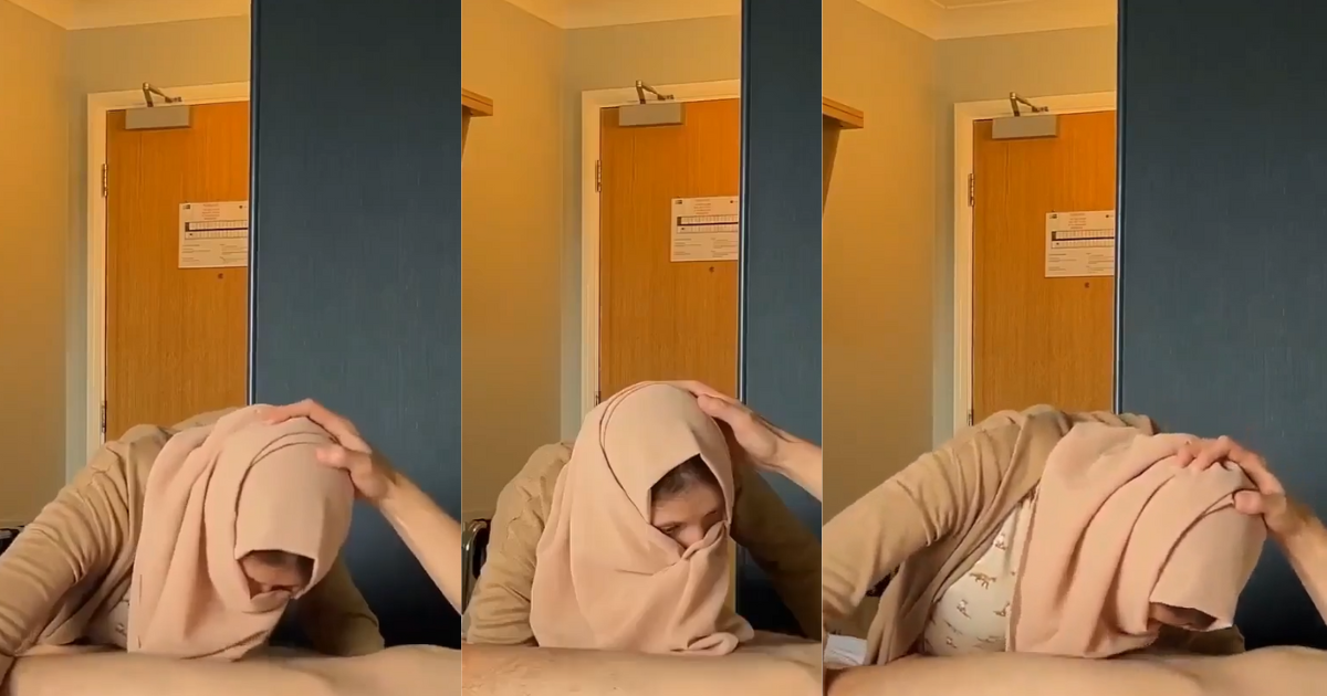 Arab woman in hijab pleasuring white man