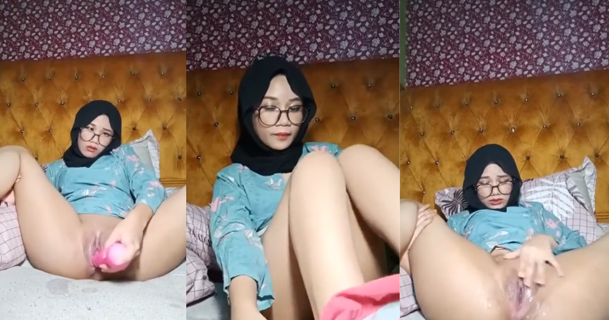 Asian woman in hijab masturbating and squirting